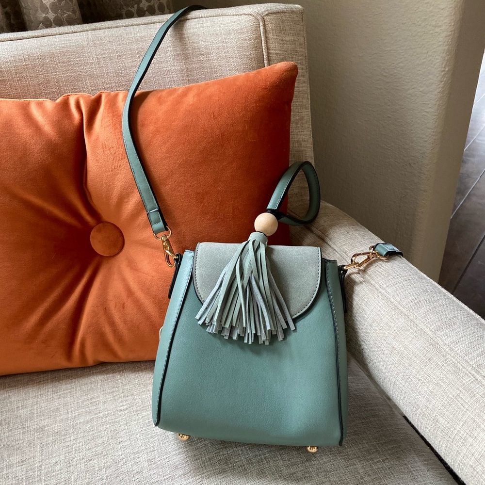 New with tags. Adorable mini aqua teal cross body handbag